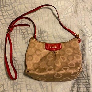 Tan with red leather Coach sling bag